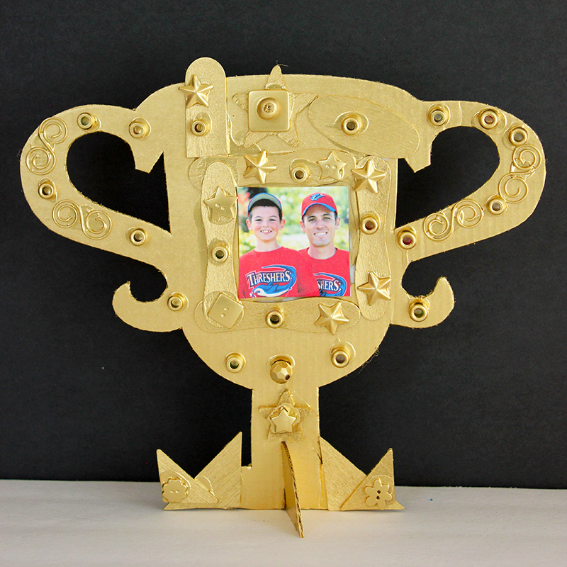 Kid-Made cardboard Father's Day trophy gift for dad on black background