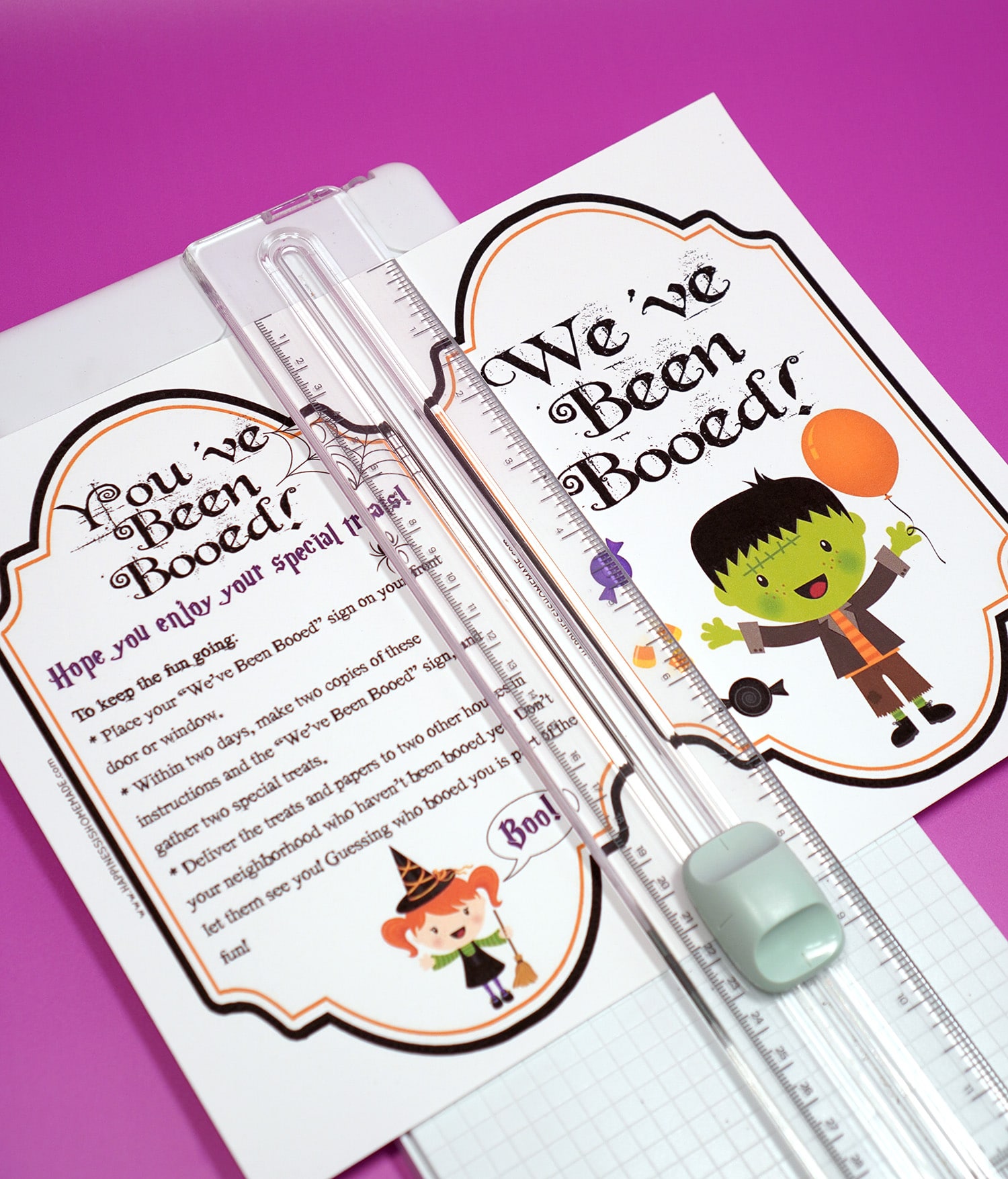 Free Booed printables in paper trimmer on purple background