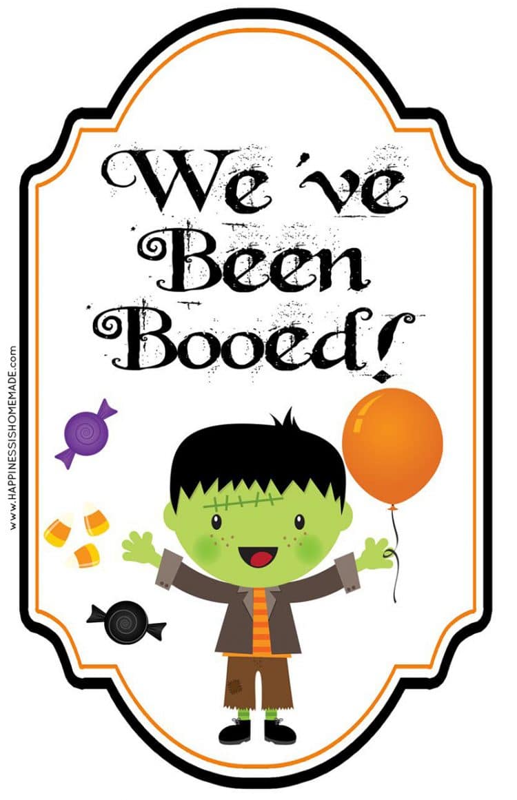 Cute printable "We've Been Booed" sign featuring a cute kid dressed as Frankenstein and candy