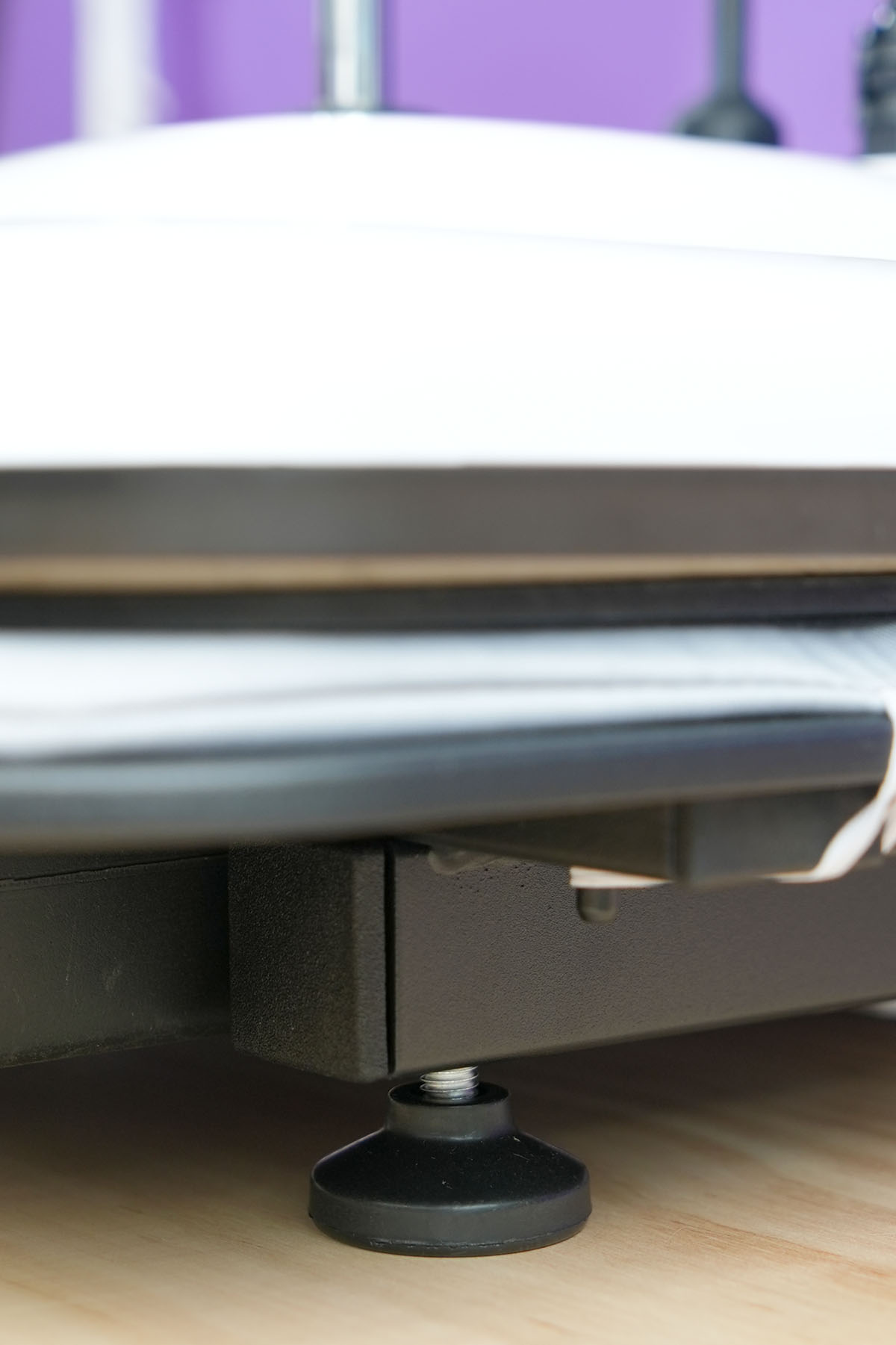 Close-up view of adjustable leveling legs on HTVRONT Manual Heat Press