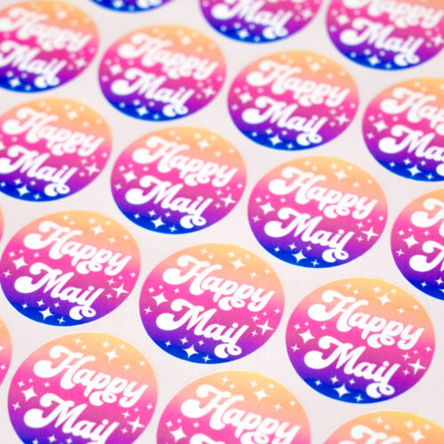 Close up of sticker sheet - full page design featuring round circle "happy mail" design in sunset colors