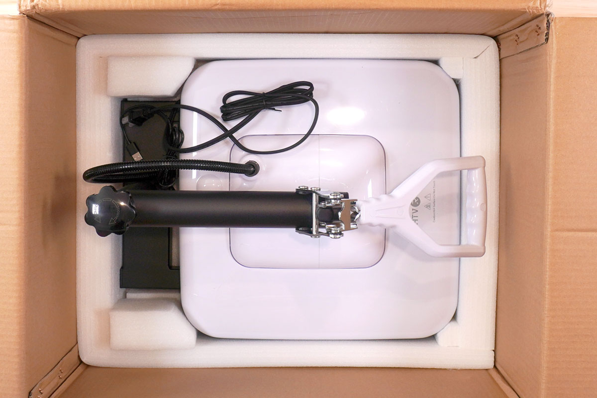 Overhead view of HTVRONT Manual Heat Press in original cardboard box (unboxing)