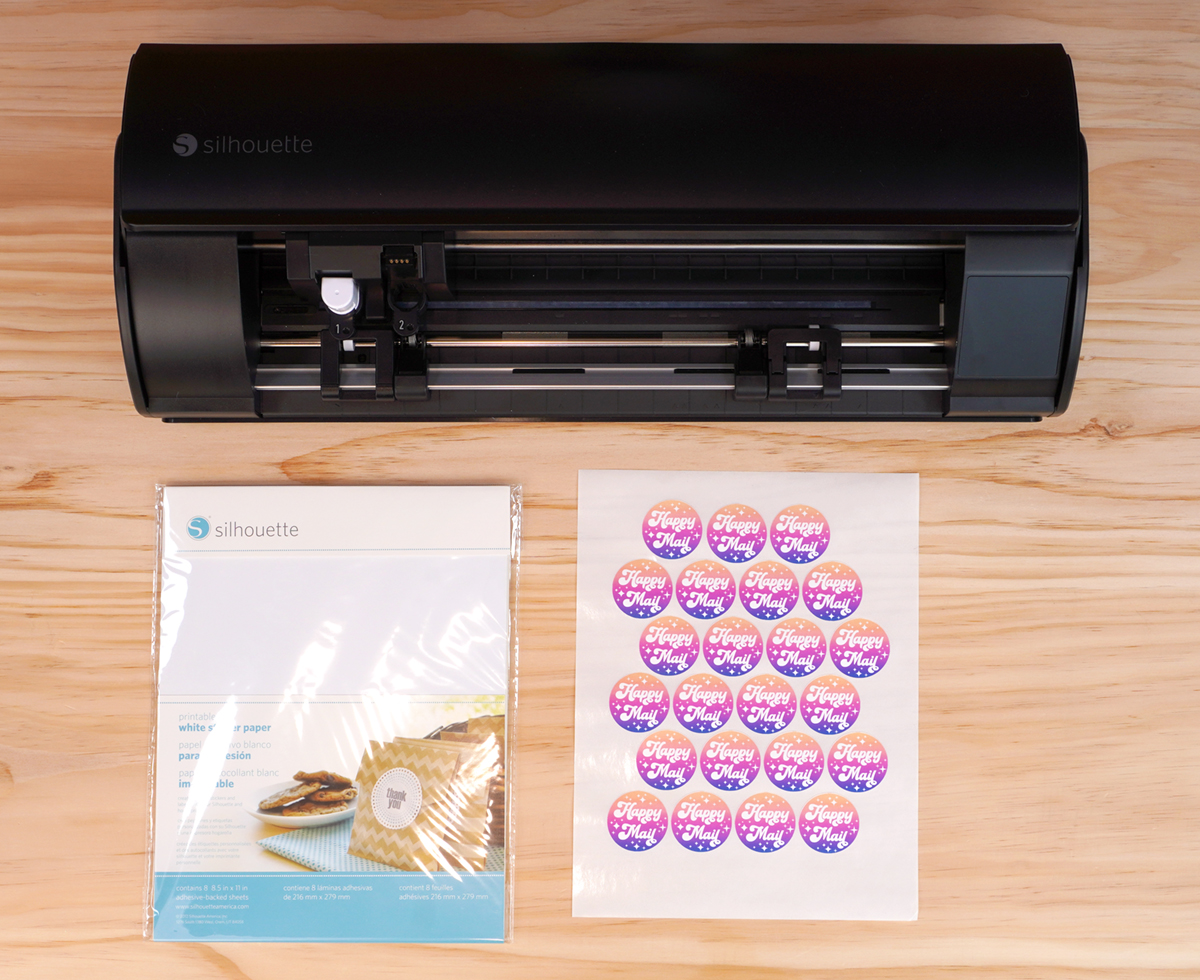 Kiss Cut Sticker Sheet with Silhouette Cameo and sticker paper on wood tabletop